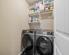 Laundry room with more storage space located just off the kitchen. 