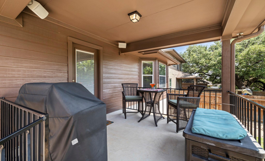 Covered patio with gas grill is perfect for hosting! 