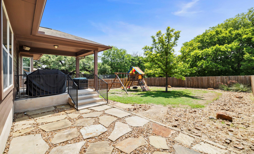 Enjoy the private, fully-fenced backyard and watch the sun set over the tree-lined greenbelt views--a rare lot with no neighbors behind you.