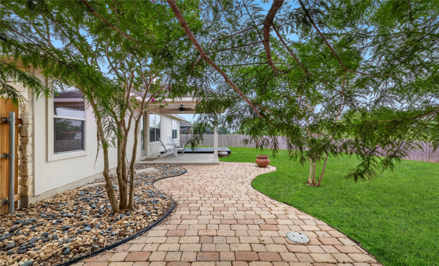 Indulge in the luxury of a beautifully landscaped yard that requires minimal upkeep, allowing you to enjoy the beauty of nature without the hassle of constant maintenance.