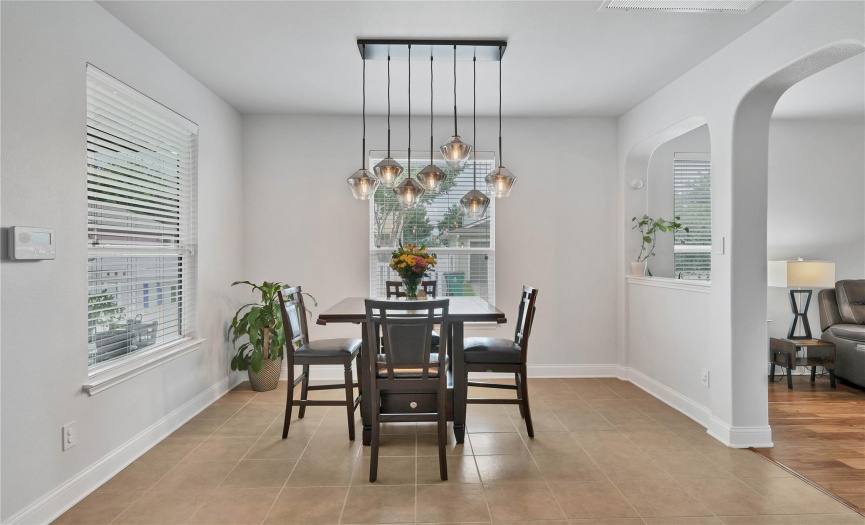 Well defined dining area adorned with luxury chandelier. Great open feel and filled with natural light. 
