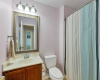 The upstairs' full bath features a tub-shower combo and single vanity with ample storage. 