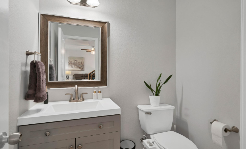The updated powder room downstairs also includes a linen closet for extra storage. 