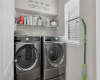 Dedicated laundry room downstairs with access from the kitchen. Washer and dryer can convey. 
