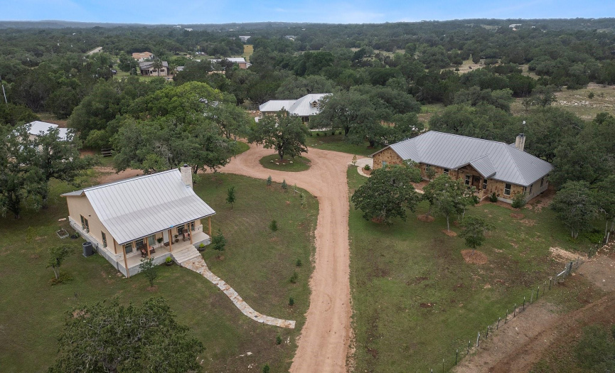 Aerial shot of the property and three homes