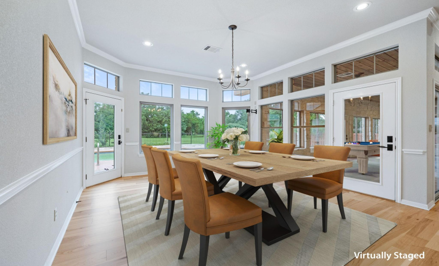 Imagine Dining with this view! Notice the newly installed wood flooring, recessed lighting, crown molding, access to flex room