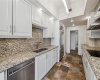 Light cabinets and stainless steel appliances are just some of the features of the kitchen.