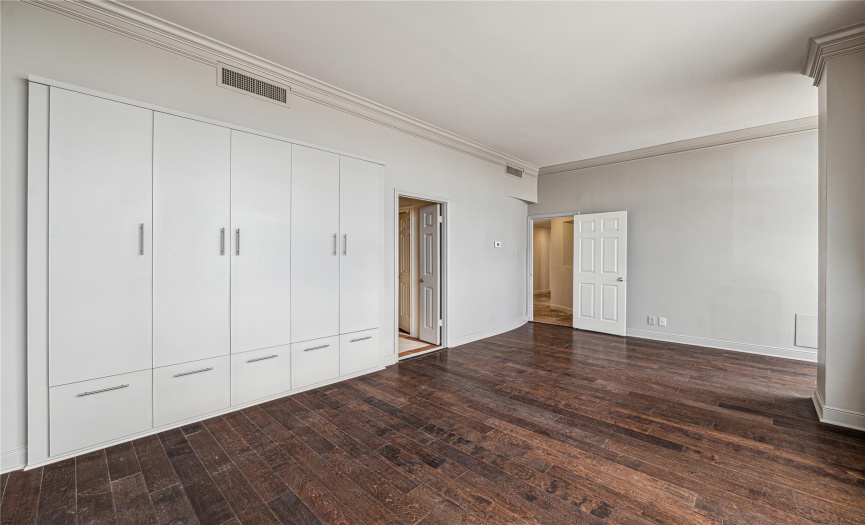Built-in cabinetry helps to maximize storage in the penthouse in addition to the walk-in closet.