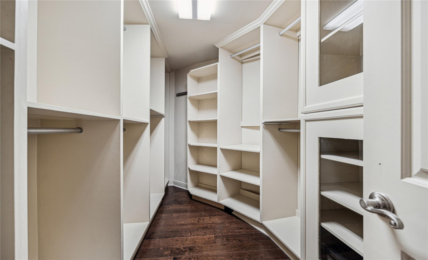 A look at the walk-in closet. There are additional built-in cabinets in the primary bedroom.