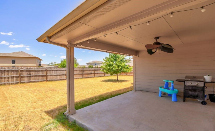 The covered patio provides plenty of space for your favorite outdoor decor.