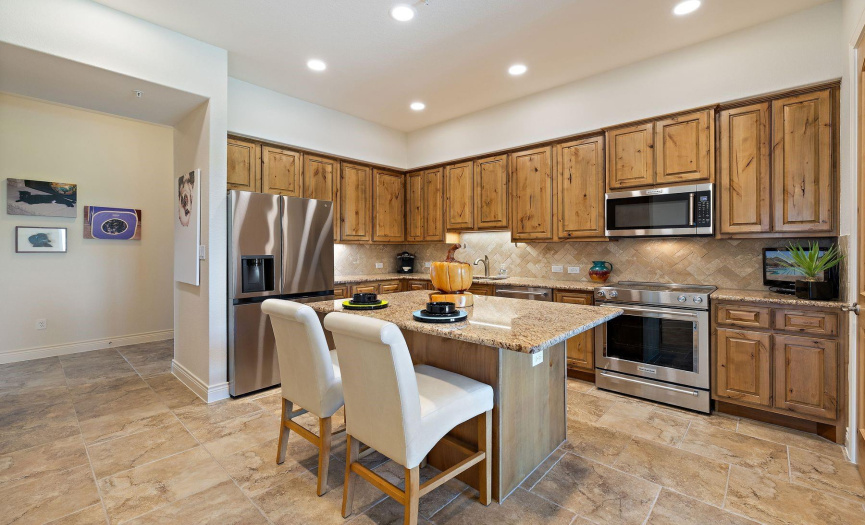 Kitchen with solid wood Knotty Alder cabinets, granite countertops and stainless appliances(Fridge conveys with unit).
