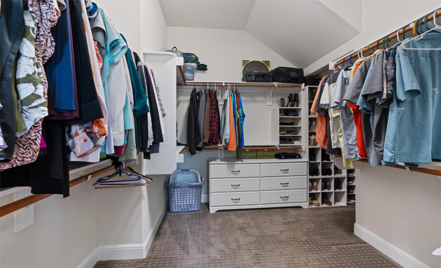 Walk-in closet has more space in the back to the right