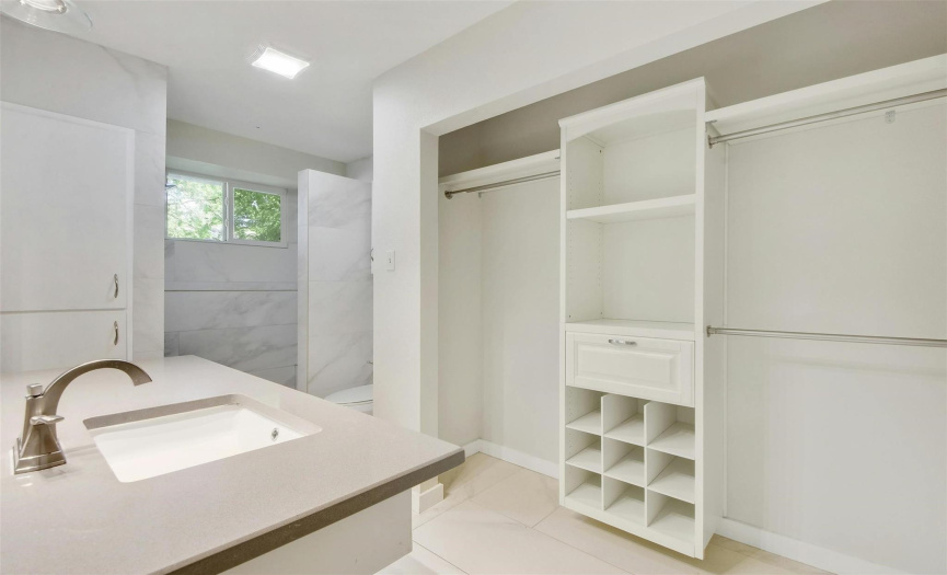 Primary Bathroom with built-ins in closet