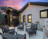 This spacious side patio is one of many relaxing outdoor spaces on the property