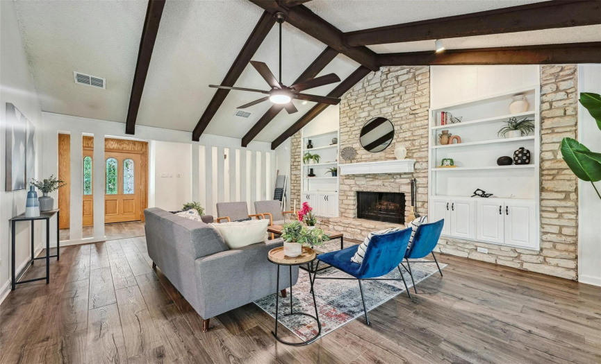 Great sized living room with vaulted ceilings, built-ins, and fireplace!