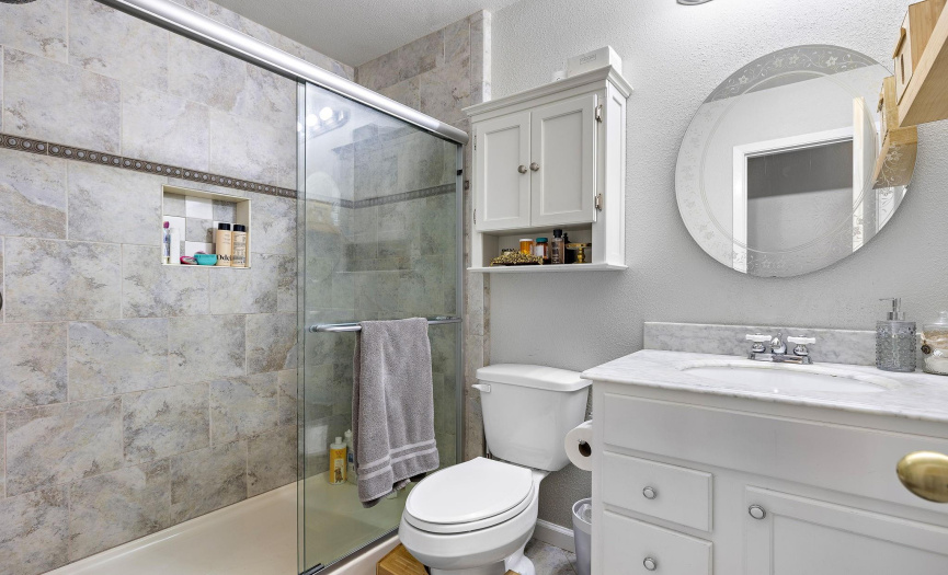 Full bathroom with updated walk in shower