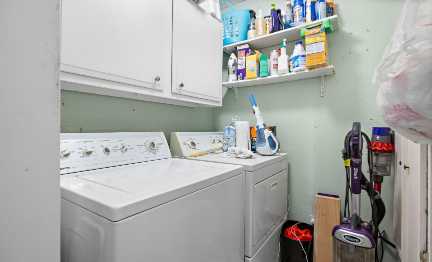This unit has a stand alone laundry room with extra storage