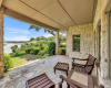 Downstairs covered porch overlooking Lake Travis.