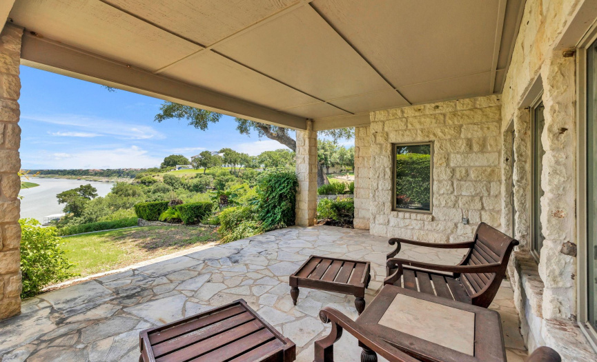 Downstairs covered porch overlooking Lake Travis.