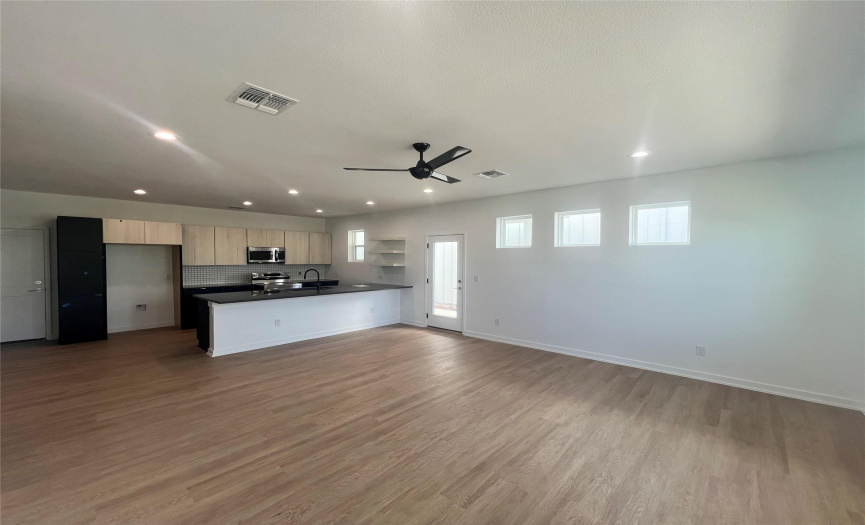 Photo is of another home in the same community with the same floorplan and simlar finishes. 