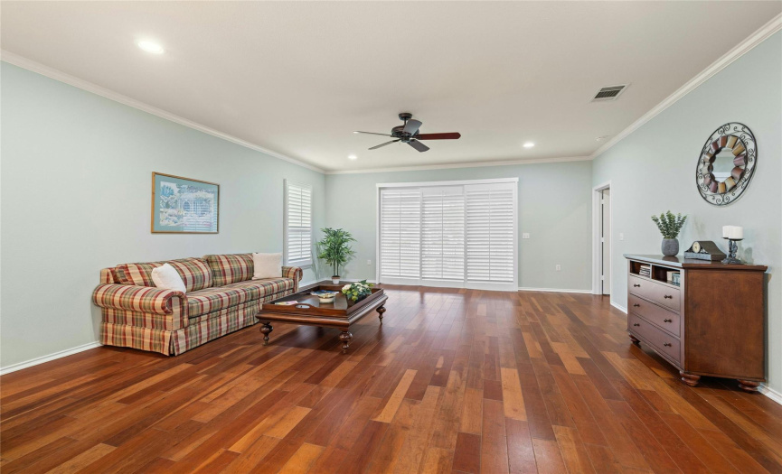 Expansive Living area with Cherry wood flooring & Plantation Shutters