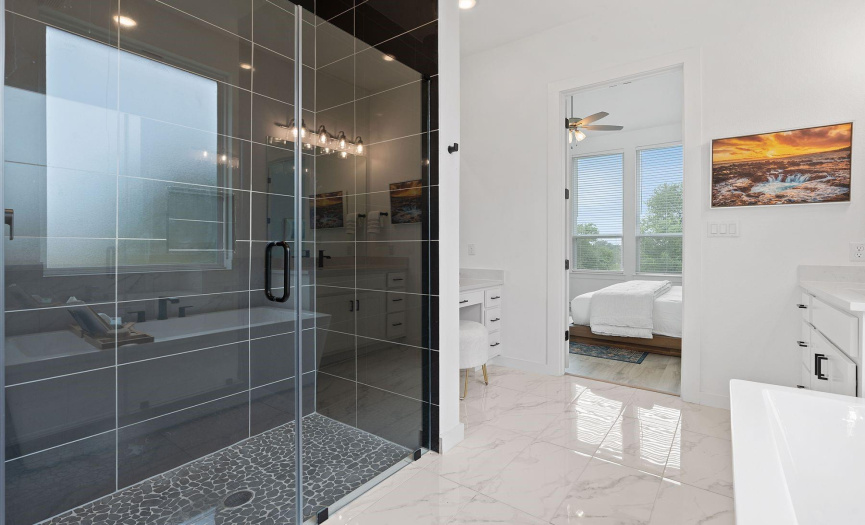 Large walk-in shower with frameless glass. 
