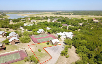 113 Courtside Way in the Lake Travis community of Ridge Harbor. Lot lines shown in photo are approximate.