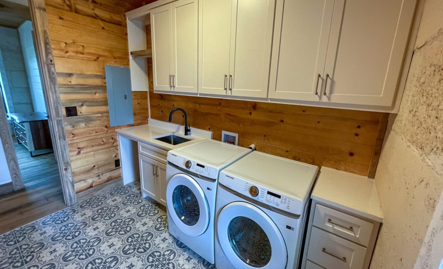 Laundry Room on Main Floor with deep sink, Washer & Dryer convey