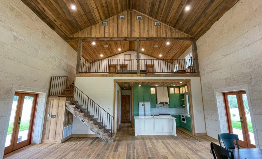 Staircase to the 2nd Floor/Loft is Custom Built with custom, antique barn wood from the Hill Country and Iron Railing