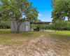 36' covered concrete pad attached to shop - good for entertaining, parking or ATV