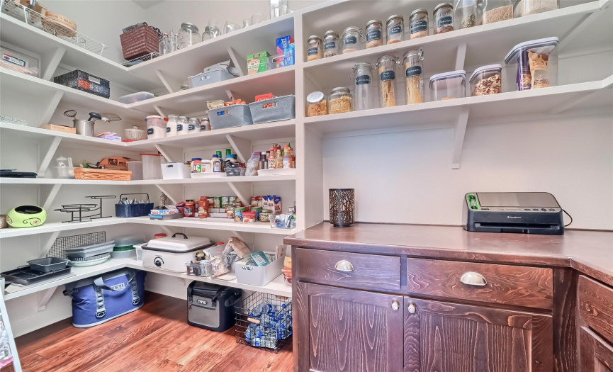 See!!! We told you it's a special bonus room with super storage. The built in cabinets & drawers make a perfect place to use the mixer, toaster, coffee maker, blender, without cluttering kitchen countertops.