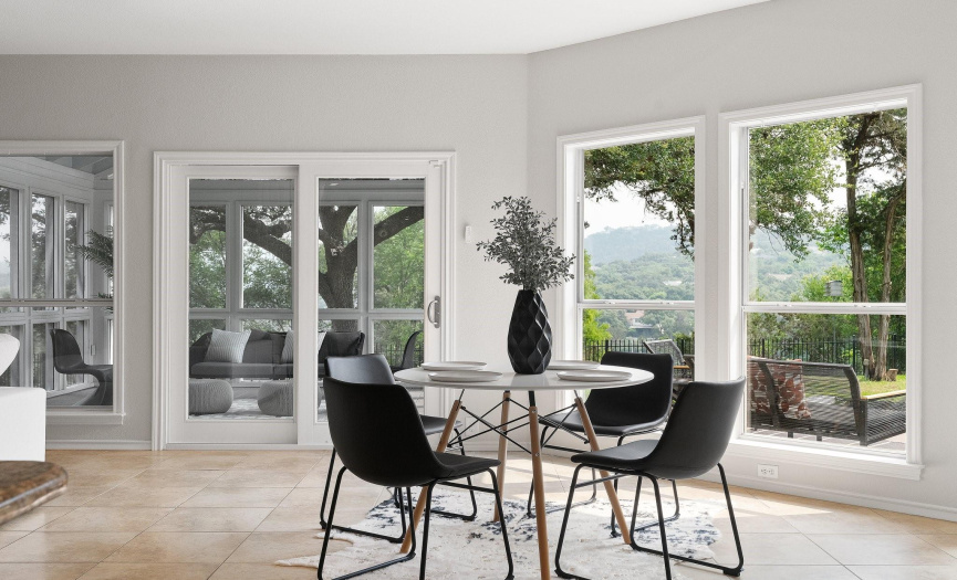 The sizable family room provides plenty of space for adding a bonus breakfast/dining area alongside a wall of windows for weeknight meals with a view.