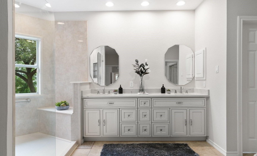 Featuring a chic French vintage inspired dual vanity with tastefully selected finishes.