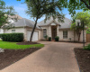 Stunning luxury greenbelt living in the highly sought-after Courtyard community of NW Austin. Excellent curb appeal with white brick masonry, mature landscaping, shade trees, and side-facing two car garage. 