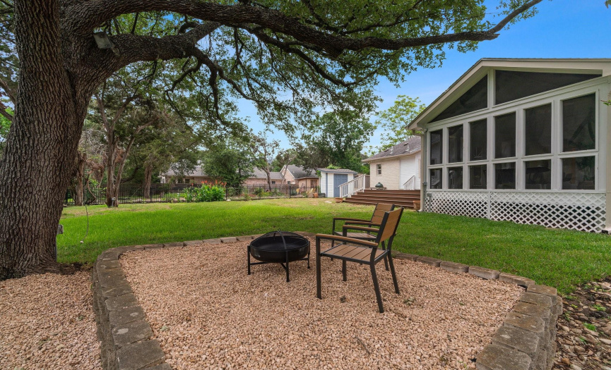 A bonus xeriscape patio area under the shade of a soaring tree provides for a scenic vista retreat. 