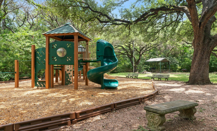The shaded playground offers hours of fun for the little ones under the cover of shade trees.  