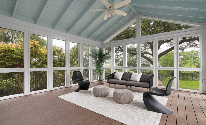The screened-in porch is a delightful retreat, perfect for enjoying the outdoors in comfort and taking in the majestic views behind the home. 