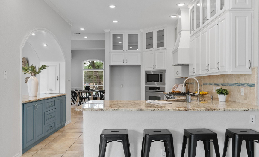 The kitchen overlooks the family room and living room and provides inviting breakfast bar seating along the peninsula that everyone will want to gather around. 