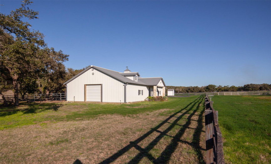 Three stall Kentucky Style horse barn and 4 large, irrigated pastures planted in Tifton 85 grasses.