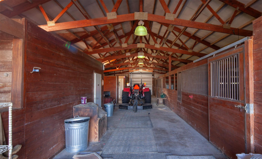 Barn for horses and equipment. Also, a full apartment with kitchen and bath.