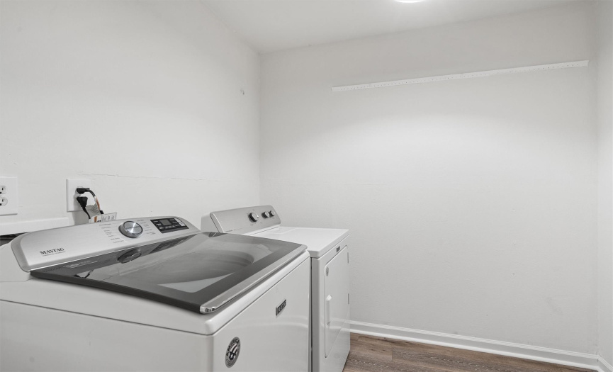 This home features a dedicated laundry room, offering convenience and functionality for your daily chores. 