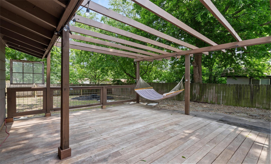 This deck provides the perfect space for outdoor dining or lounging, offering a peaceful retreat surrounded by nature.