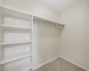 This bedroom has ample closet space, plus shelves for shirts, sweaters or shoes. 