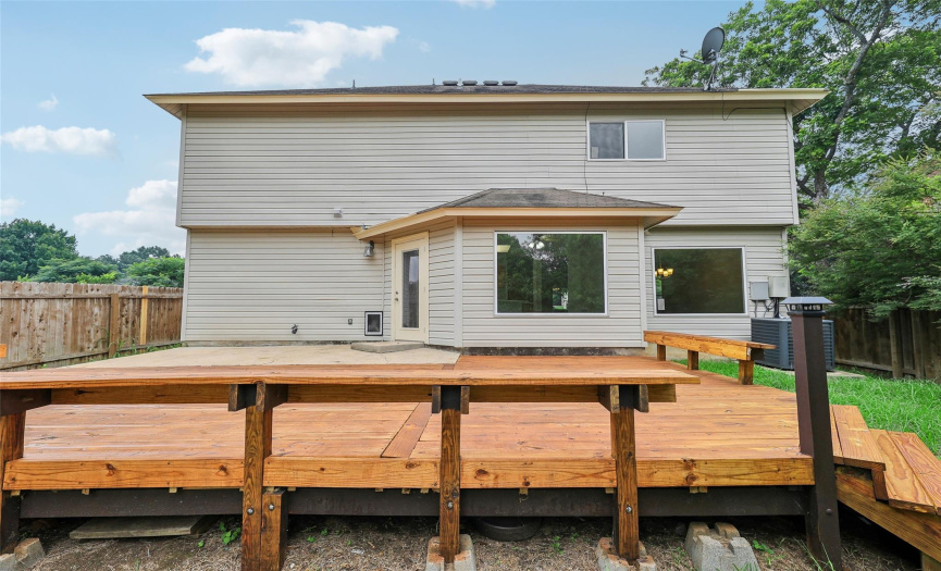 This huge wooden deck was recently installed. It's great for entertaining, as it has plenty of seating for parties.