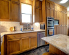 Beautiful granite countertops in roomy kitchen with quality stainless steel appliances