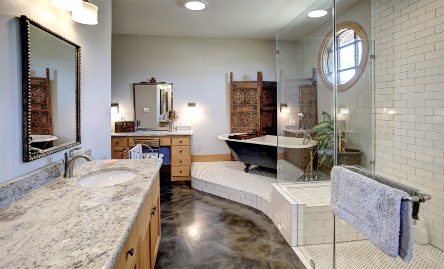 Check out the beautiful tile work, granite countertops & Huge walk in shower with seat.