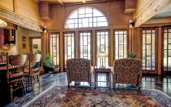 Exquisite custom windows and doors welcome you to this private retreat