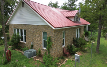 Stone and Metal Cottage Style Home on 2 Fabulous Acres! 