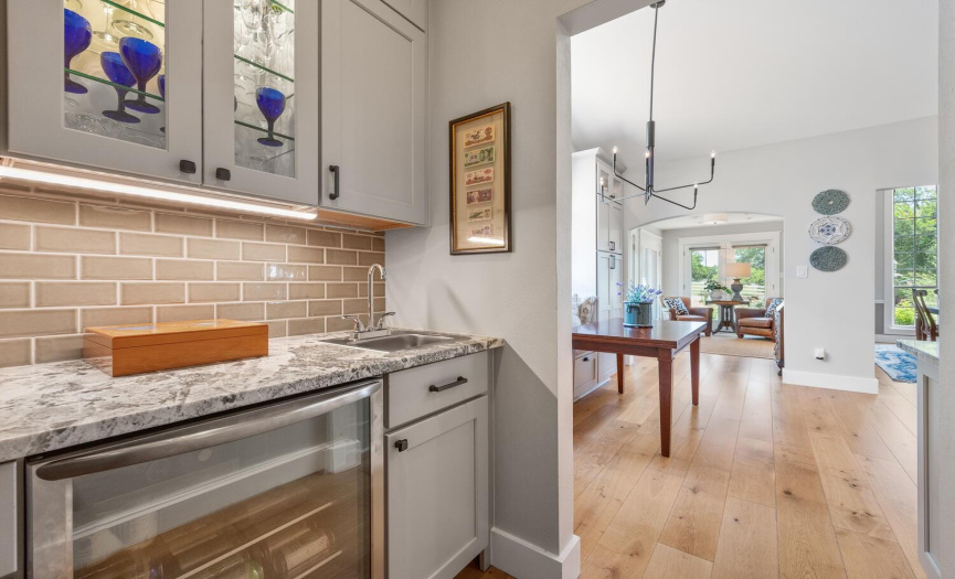 Lovely yet functional butler's pantry (with prep sink, beverage refrigerator and extra storage) connects the kitchen to the mud room