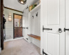 Charming mud room with custom Dutch door... just the space for your garden boots, rain coats and wet dogs!